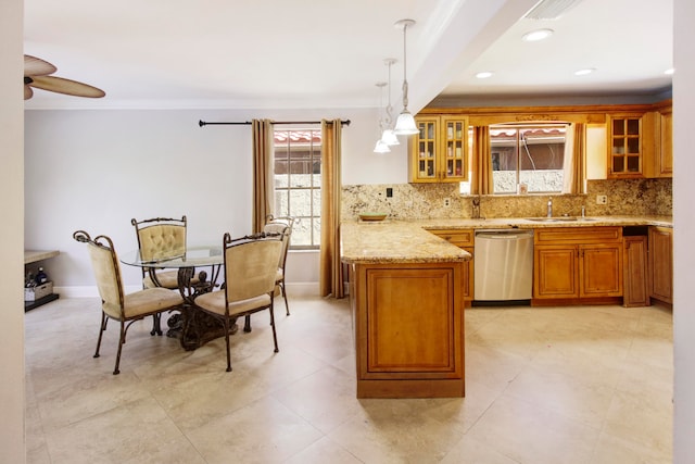 kitchen with stainless steel dishwasher, tasteful backsplash, ceiling fan, pendant lighting, and light tile patterned floors