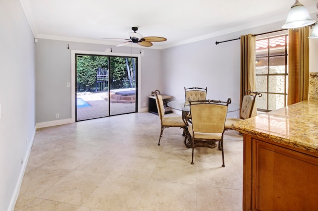 tiled dining room featuring ornamental molding, a wealth of natural light, and ceiling fan