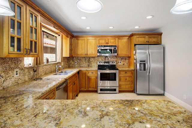 kitchen with sink, appliances with stainless steel finishes, tasteful backsplash, and light tile patterned floors