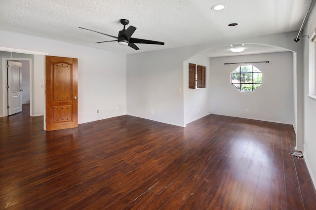 empty room with a textured ceiling, ceiling fan, and hardwood / wood-style floors