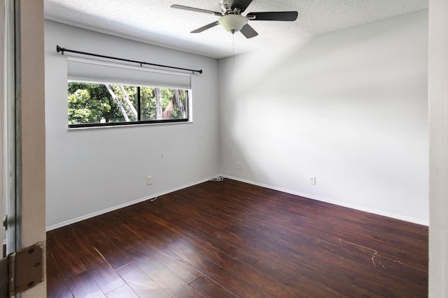 empty room featuring ceiling fan, hardwood / wood-style floors, and a textured ceiling