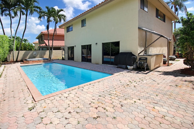 view of swimming pool with a patio area