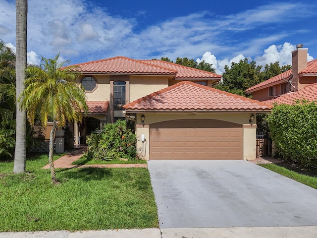 mediterranean / spanish-style house with a garage and a front yard