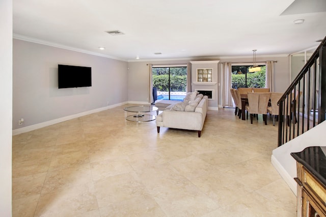 tiled living room featuring plenty of natural light and ornamental molding