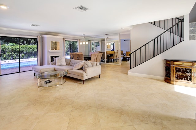 tiled living room with crown molding and a chandelier