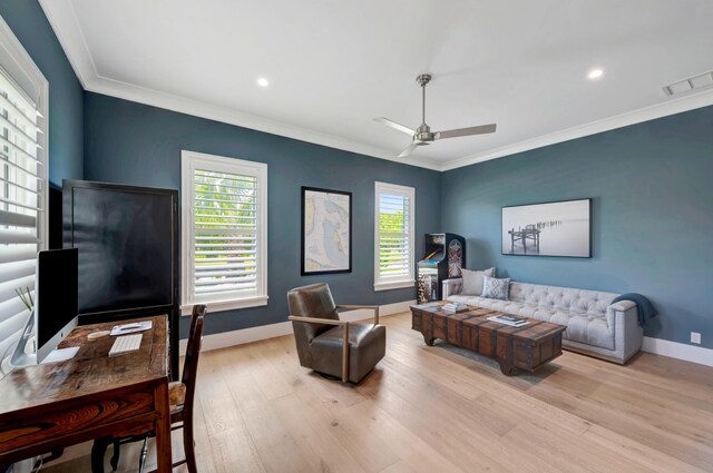 living room featuring ceiling fan, crown molding, and light hardwood / wood-style flooring