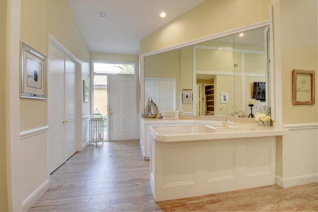 bathroom with vanity and hardwood / wood-style flooring