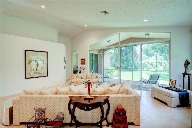 tiled living room with lofted ceiling and a textured ceiling