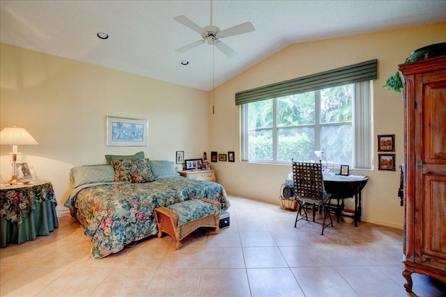 bedroom with light tile patterned floors, vaulted ceiling, and ceiling fan