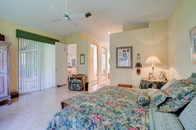 bedroom featuring multiple windows, ceiling fan, lofted ceiling, and light tile patterned floors