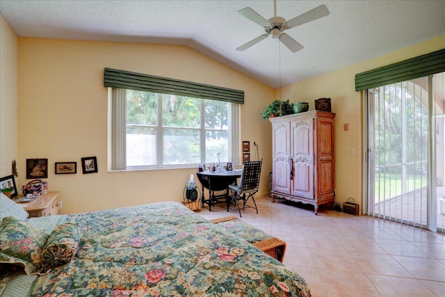 tiled bedroom with access to outside, a textured ceiling, ceiling fan, and vaulted ceiling