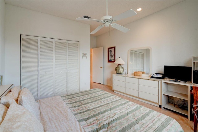 bedroom featuring a towering ceiling and ceiling fan