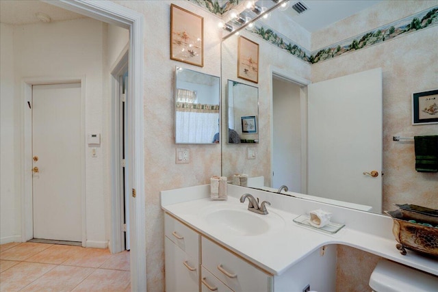 bathroom with tile patterned flooring and vanity