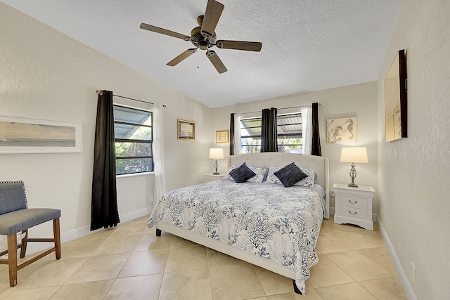 bedroom featuring a textured ceiling, multiple windows, and vaulted ceiling