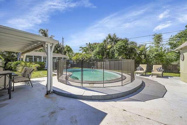 view of pool with a patio, fence, and a fenced in pool