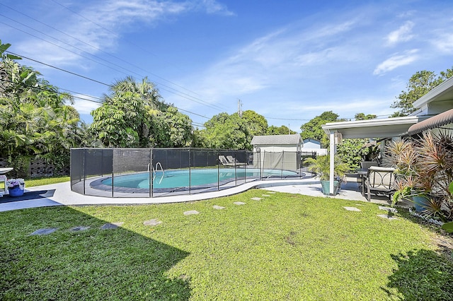 view of pool featuring a patio area, fence, a fenced in pool, and a yard