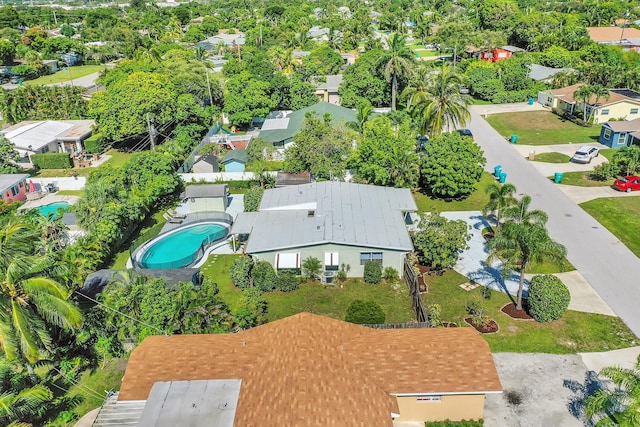 birds eye view of property with a residential view