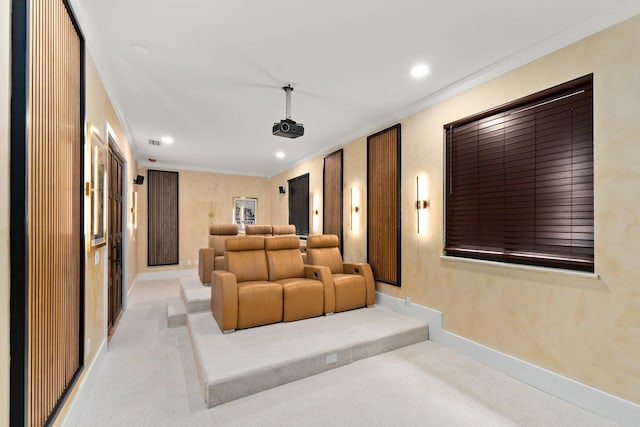 carpeted home theater with crown molding