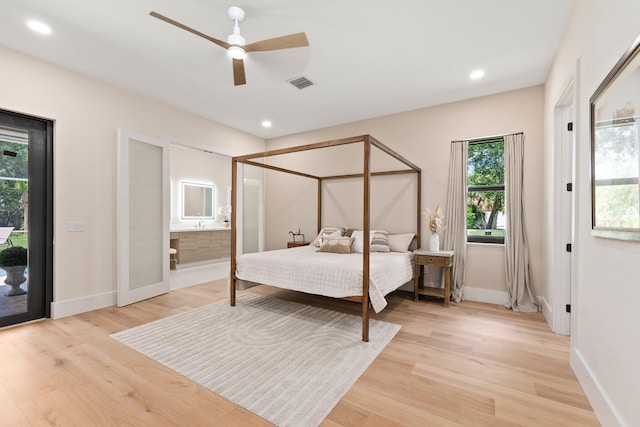 bedroom with ensuite bath, access to exterior, ceiling fan, and light hardwood / wood-style floors