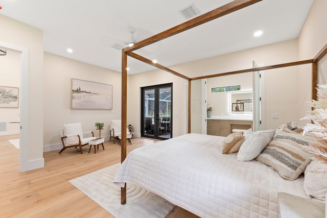 bedroom with access to exterior, french doors, and light hardwood / wood-style flooring