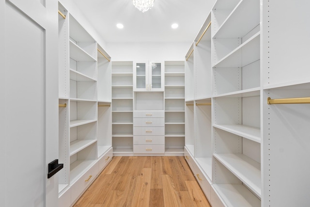 walk in closet featuring light hardwood / wood-style flooring