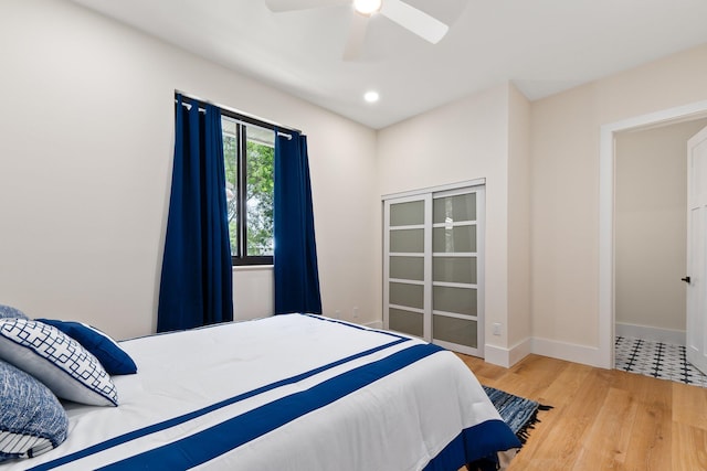 bedroom with light tile patterned flooring and ceiling fan