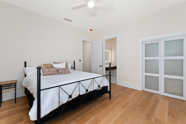 bedroom with light wood-type flooring and ceiling fan