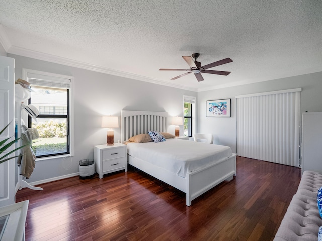 bedroom featuring multiple windows, ceiling fan, dark hardwood / wood-style floors, and crown molding