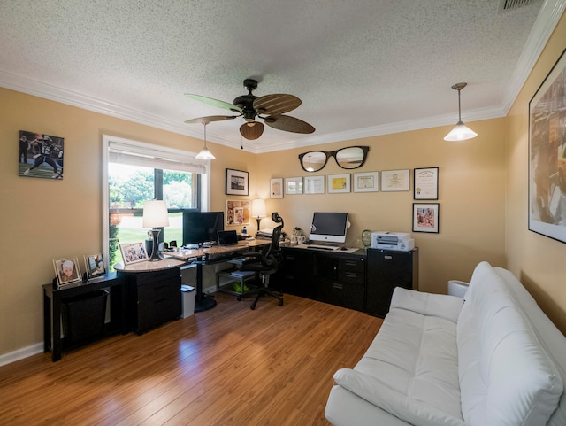 office space featuring ornamental molding, a textured ceiling, hardwood / wood-style flooring, and ceiling fan