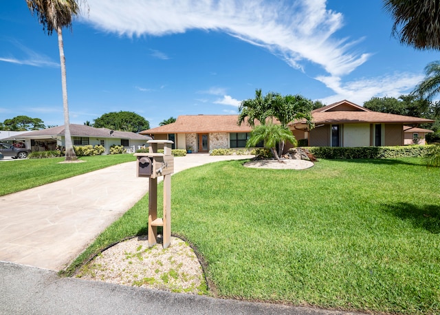 single story home featuring a front yard