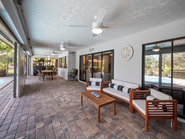 sunroom / solarium with ceiling fan