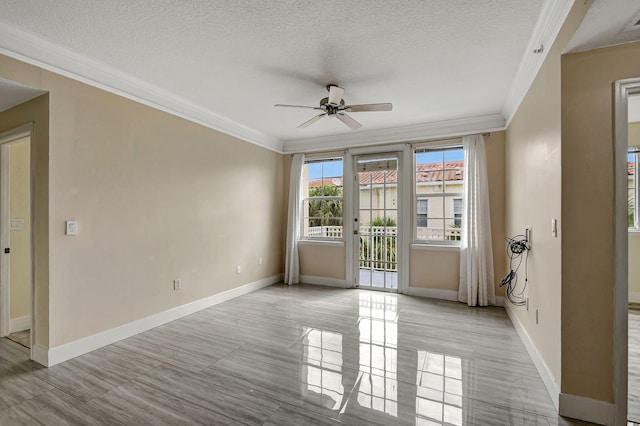 spare room featuring ornamental molding, french doors, a textured ceiling, ceiling fan, and light tile patterned flooring