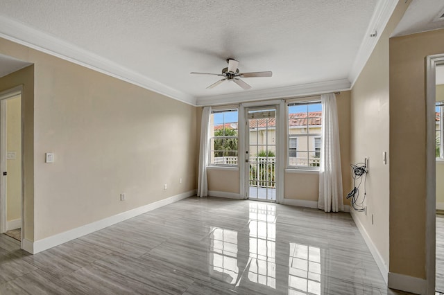9873 Baywinds Dr Unit 5302, West Palm Beach, FL 33411 - empty room featuring a ceiling fan, crown molding, a textured ceiling, and baseboards