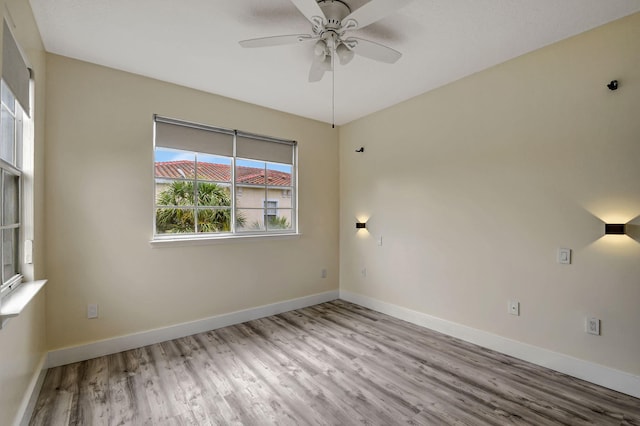 unfurnished room featuring ceiling fan and light wood-type flooring