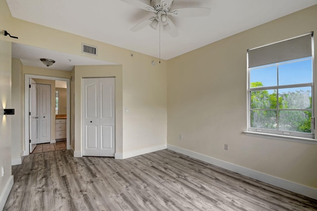 spare room featuring ceiling fan and hardwood / wood-style floors