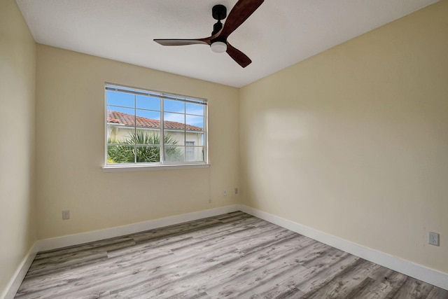 empty room featuring light hardwood / wood-style flooring and ceiling fan