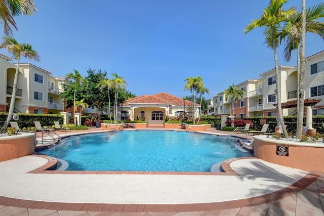 9873 Baywinds Dr Unit 5302, West Palm Beach, FL 33411 - community pool featuring a residential view and a patio