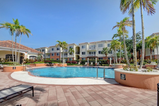 9873 Baywinds Dr Unit 5302, West Palm Beach, FL 33411 - community pool with a residential view and a patio