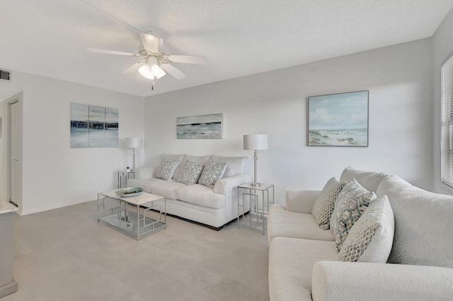 living room featuring a textured ceiling, ceiling fan, radiator, and light colored carpet