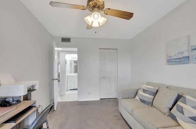 living room featuring carpet floors and ceiling fan