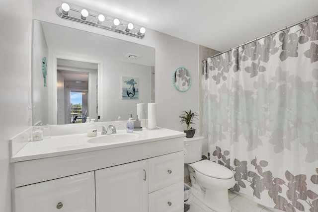 bathroom with tile patterned flooring, a shower with shower curtain, vanity, and toilet