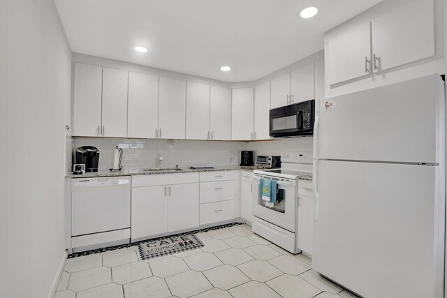 kitchen featuring white appliances, white cabinets, sink, backsplash, and light tile patterned flooring