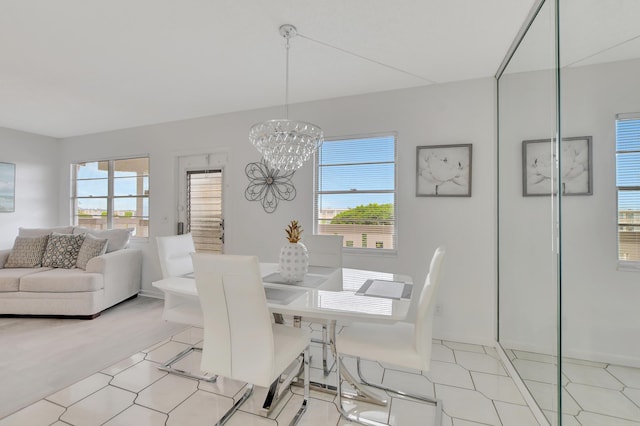 dining area featuring a chandelier and a wealth of natural light