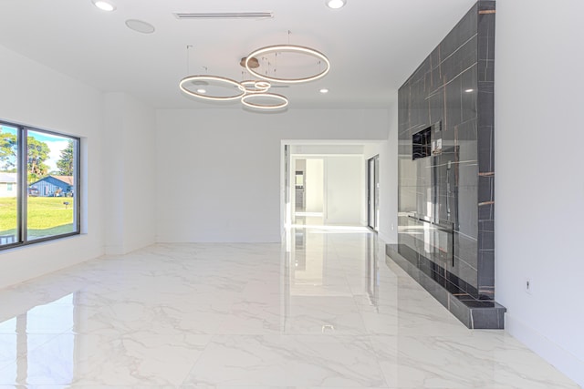 empty room featuring recessed lighting, marble finish floor, visible vents, and baseboards