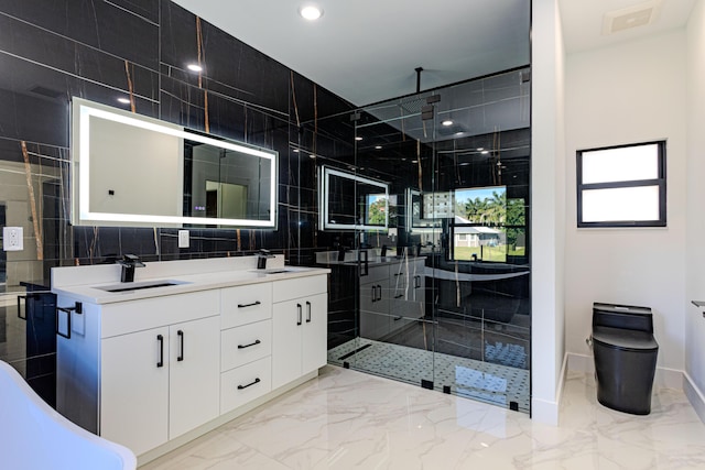 full bathroom with marble finish floor, a shower stall, visible vents, and a sink