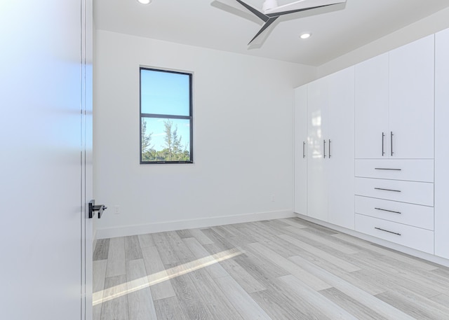 interior space with ceiling fan, light wood finished floors, baseboards, and recessed lighting