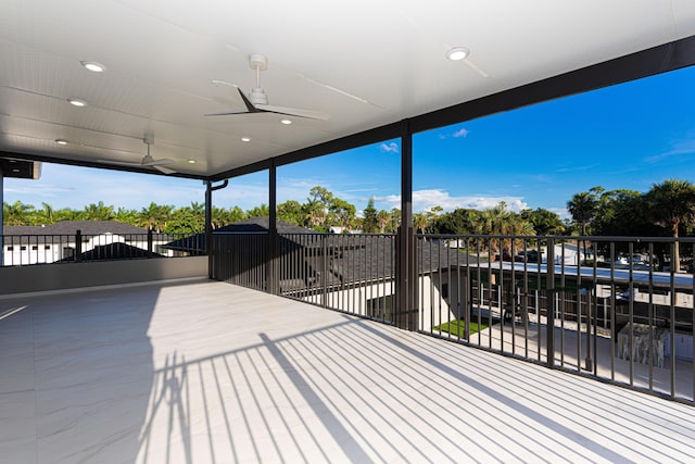 wooden terrace featuring ceiling fan