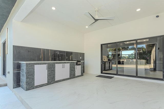 view of patio / terrace with ceiling fan and area for grilling