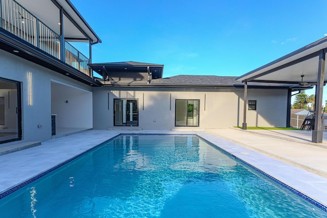 pool featuring ceiling fan and a patio