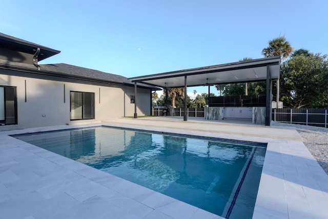 view of pool with a patio area, fence, and a fenced in pool